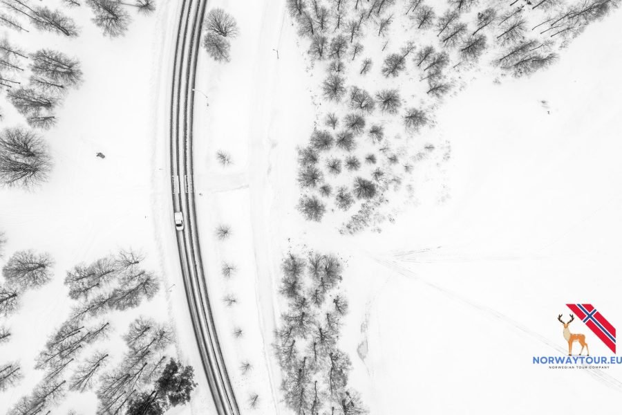 Aerial view of a snow-covered road from Levi to Rovaniemi during winter