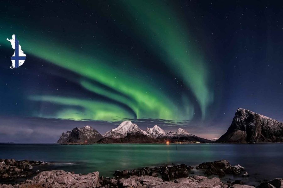 Northern Lights illuminating the sky in Lapland, part of the 6 days Finland tour package.