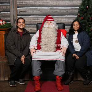 Karan and his wife posing with Santa Claus during their Finland tour with finlandtour.fi