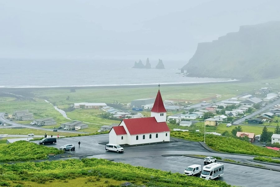 Side aerial view of Vik village in Iceland, a scenic stop on the 18 Days Iceland, Norway and Finland tour.