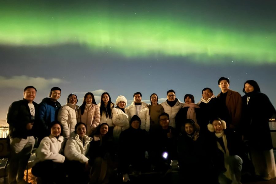 A group of travelers on a Northern Lights tour in Tromsø during the 17 Days Iceland, Norway and Finland Tour Itinerary.