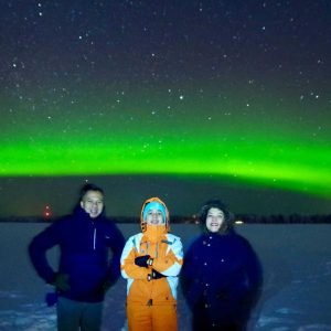 Family enjoying Northern Lights tour in Lapland during their 7 days Finland tour from HK