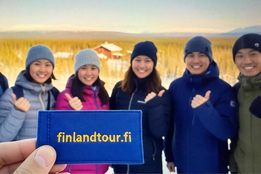 Group of happy tourists in Finland, booked through finlandtour.fi, enjoying their 8 nights 9 days Finland tour from Singapore.