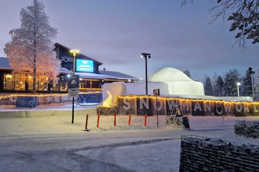 Visitors enjoying the icy attractions at Snowman World in Santa Claus Village, Rovaniemi, during their 4 nights 5 days Finland tour from Singapore.