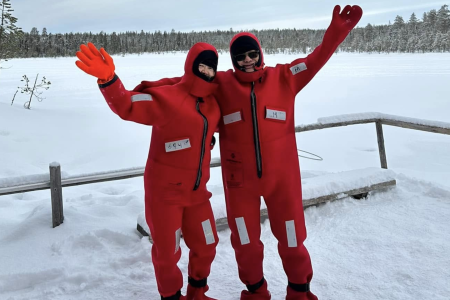 Traveler couple from Hong Kong wearing snow swim suits in Kemi during their 9 days Finland tour from Hong Kong