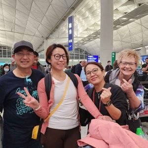 Travelers at Hong Kong airport ready to depart for a Finland Northern Lights tour