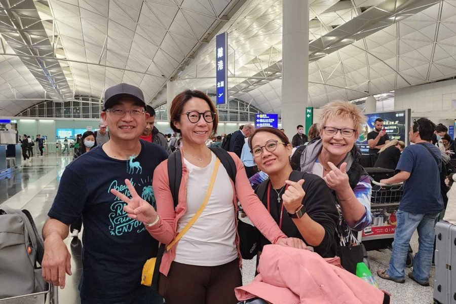 Travelers at Hong Kong airport ready to depart for a Finland Northern Lights tour