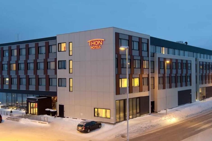 Aerial view of Thon Hotel Kirkenes, cozy exterior surrounded by snow during winter for 7D Kirkenes, Saariselka & Rovaniemi tour