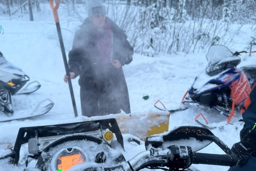 Travelers enjoying snowmobile during their 6D5N Arctic tour of Finland from Australia