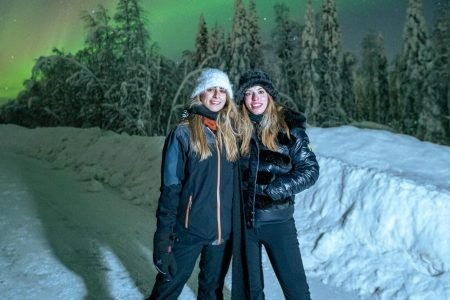 Travelers from Australia enjoying Northern lights in Rovaniemi