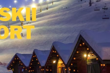 Levi Ski Resort in Finnish Lapland during winter, featuring snowy ski slopes, chairlifts and cozy cabins on a private Finland Northern Lights tour.